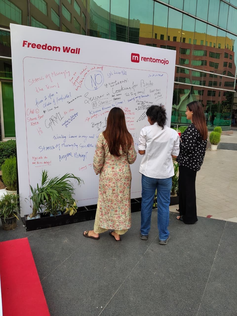 RentoMojo Freedom Wall installation with employees writing what freedom means to them at a Delhi NCR corporate office