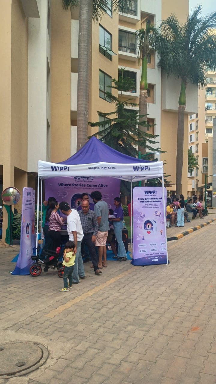 A family with a young child at the Wippi gazebo inside a Bengaluru residential community