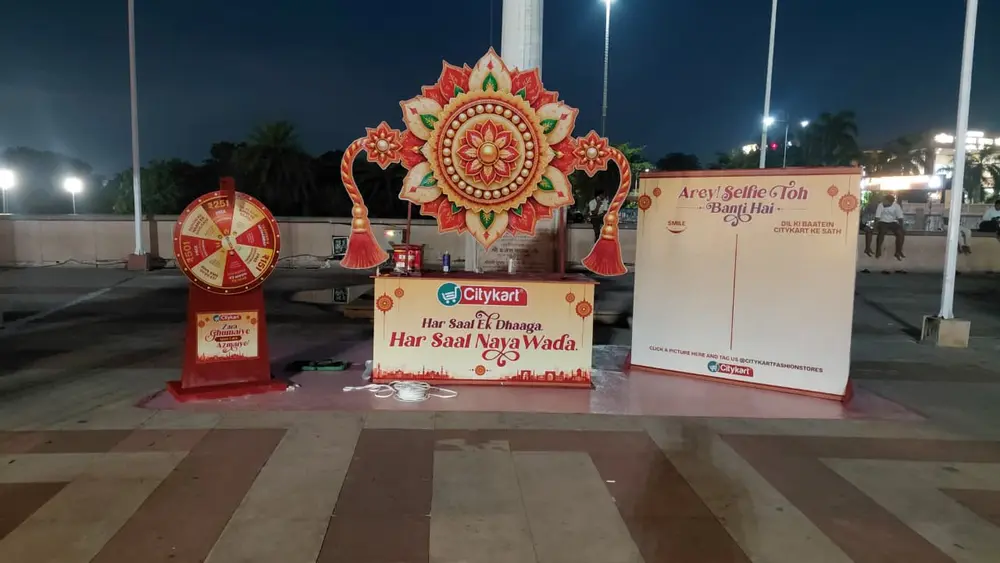 Citykart larger-than-life Rakhi installation, branded counter and photo wall set up at 1090 Chauraha, Lucknow, an on ground activation by CupShup