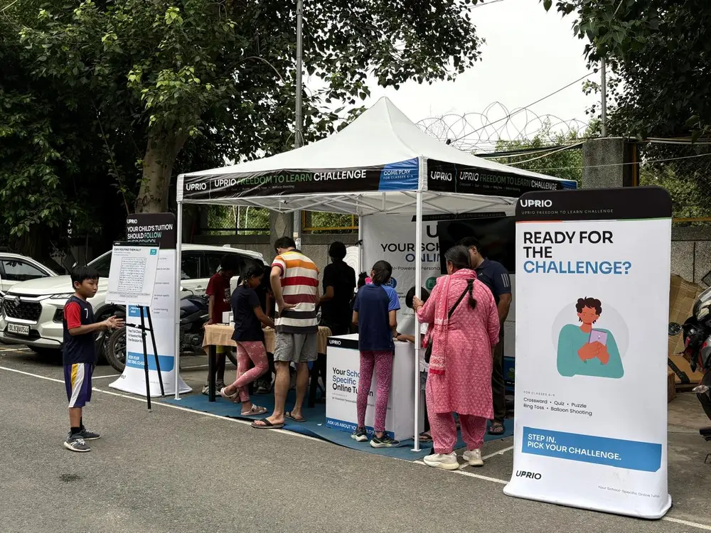 UPRIO Freedom to Learn Challenge tent and banners with children playing at the game-based activation in Delhi